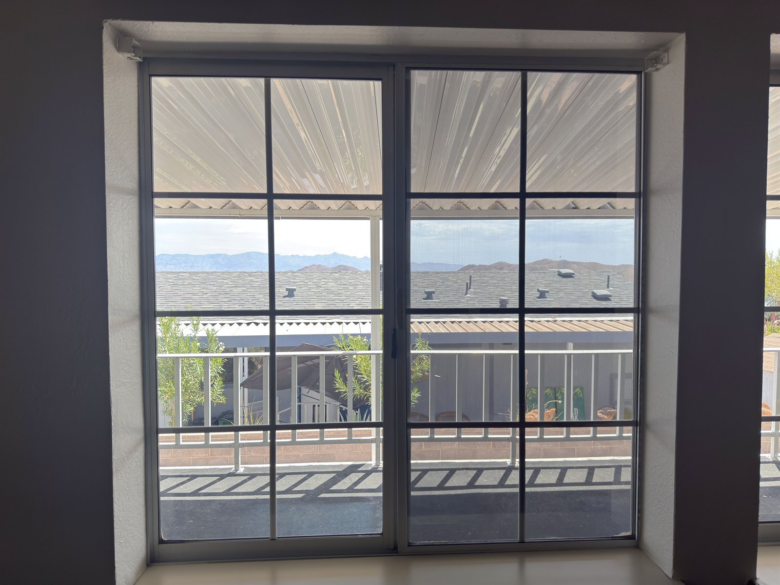 Before and after ceramic window film on a patio window, Boulder City NV